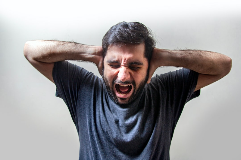 No anger or emotions allowed in passport photos. Maintain a neutral expression with closed mouth and direct gaze.