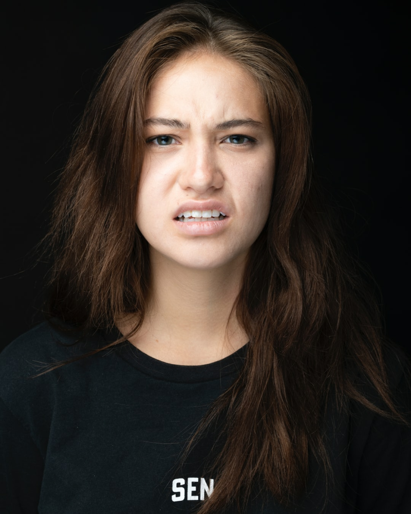 Understand why showing disgust in passport photos is not allowed. A neutral facial expression is required for clear, consistent identification purposes.