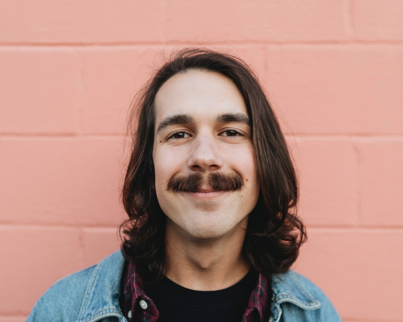 Wearing a mustache in passport photos is generally allowed, but it's important to ensure the photo accurately represents your current appearance.